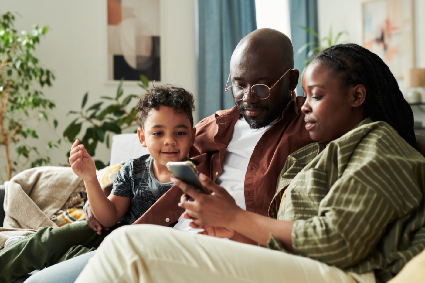 A family looking at a smartphone screen together